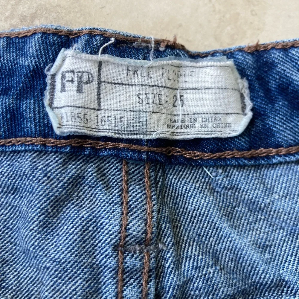 Free People Distressed Blue Denim Shorts with Lace Accents